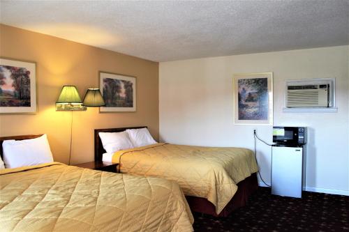 Voodi või voodid majutusasutuse Cascades Motel - Chattanooga toas