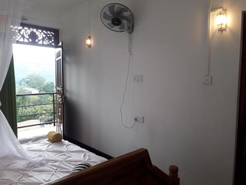 Katil atau katil-katil dalam bilik di Elegant Home Stay