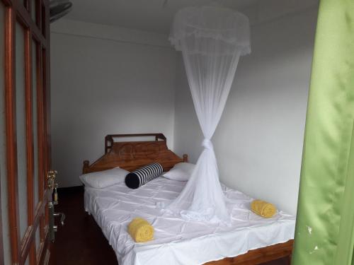 Katil atau katil-katil dalam bilik di Elegant Home Stay