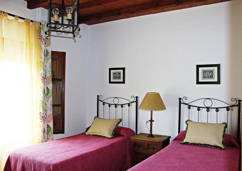 Voodi või voodid majutusasutuse Villa del Sol toas
