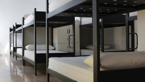 Ένα ή περισσότερα κρεβάτια σε δωμάτιο στο Trevejo Hostel