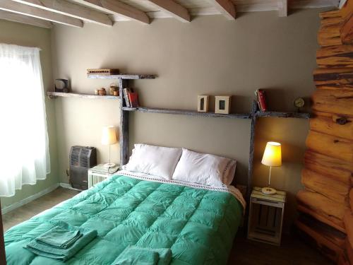 Un pat sau paturi într-o cameră la Albatros cabaña