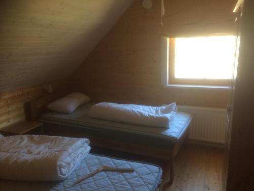 A bed or beds in a room at Aasa Puhkemaja