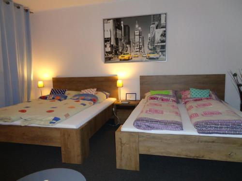 Postel nebo postele na pokoji v ubytování Apartamenty Wyspiańskiego