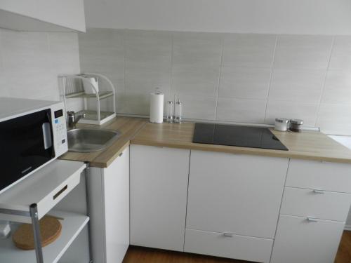 Kuchyňa alebo kuchynka v ubytovaní Apartman Perica