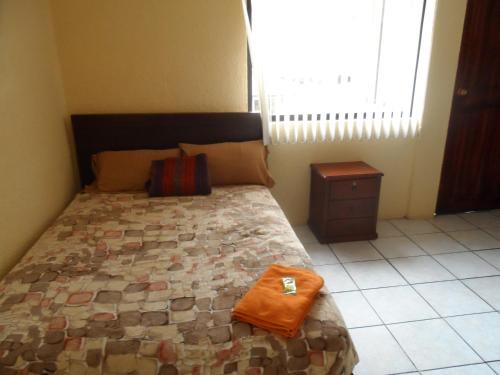 Hostal Monte Carmeloにあるベッド