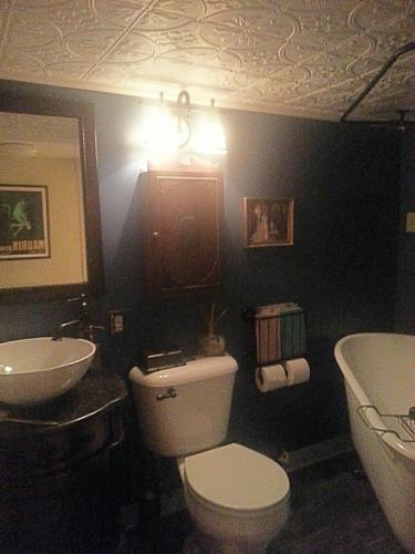 a bathroom with a toilet and a sink and a tub at The Pines of Dresden in Dresden
