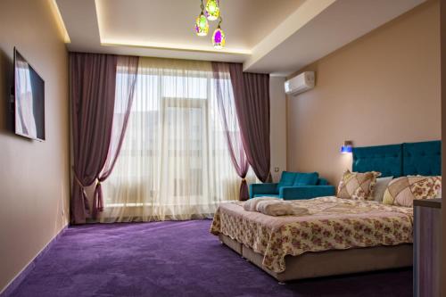Postel nebo postele na pokoji v ubytování Horizon Hotel