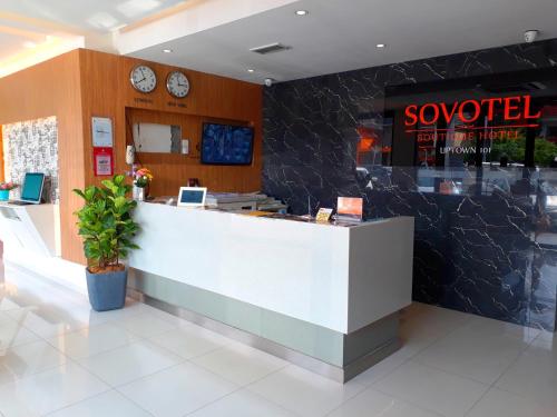 a lobby of a restaurant with a reception counter at Sovotel Uptown 101 in Petaling Jaya