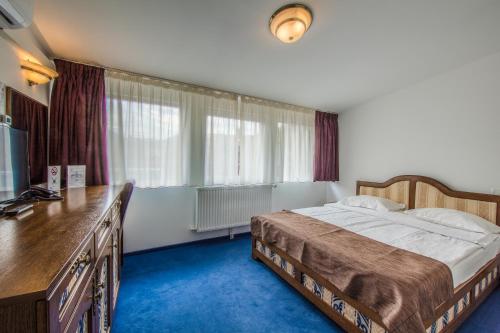 Ένα ή περισσότερα κρεβάτια σε δωμάτιο στο Residence Central Annapolis