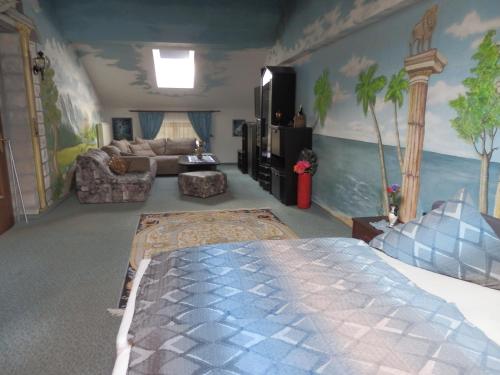 a bedroom with a bed and a living room at Reiserhof in Zell am Ziller