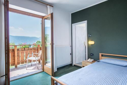 Postel nebo postele na pokoji v ubytování Al Pian Garnì Hotel - B&B & Pizza