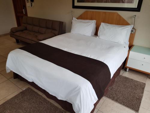 Postel nebo postele na pokoji v ubytování Europrime Hotel