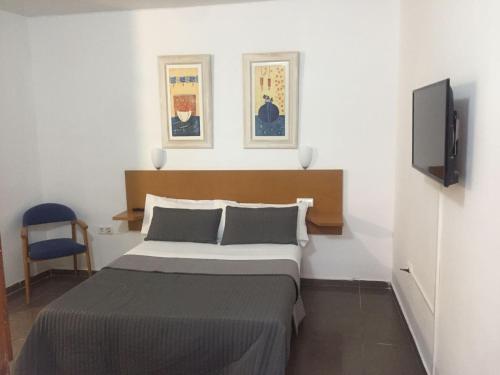 Sant Pere Apartmentにあるベッド