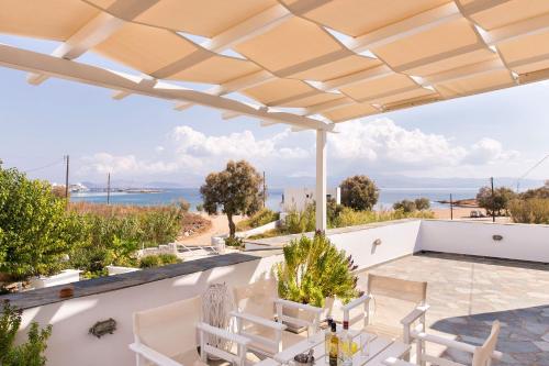 a villa with a view of the ocean at Villa San Dimitrio House on the Beach in Logaras