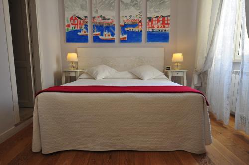a bedroom with a large bed with two night stands at Casa Martini in Rome