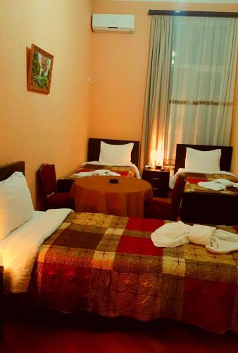 Postel nebo postele na pokoji v ubytování Hotel Sali