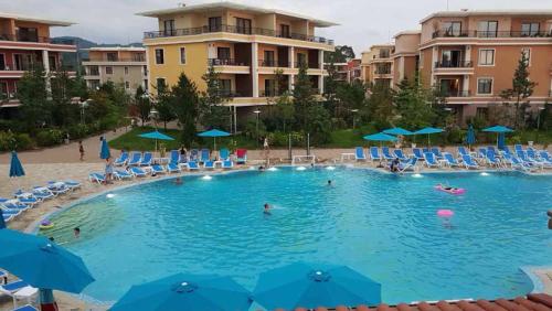 a large swimming pool with people in a resort at Dreamland oasis in Chakvi in Chakvi
