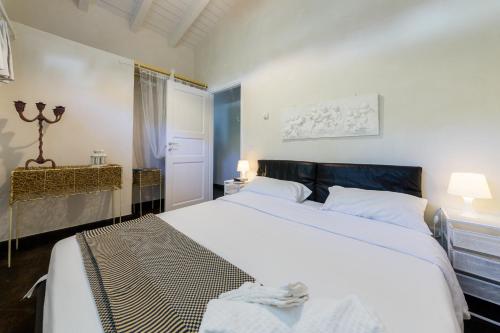 Postel nebo postele na pokoji v ubytování Villa Tipica "Arancelli 11"