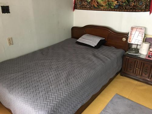 Llit o llits en una habitació de MK GuestHouse