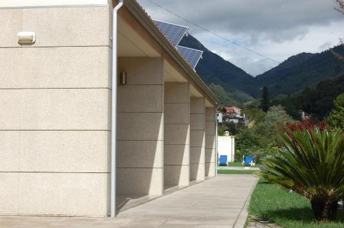 a side view of a building with a sidewalk at Casinhas do Gerês in Geres