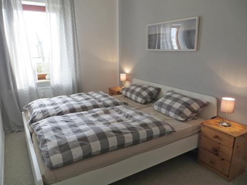 En eller flere senge i et værelse på Ferienwohnung Achtern Diek
