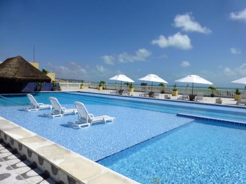 Kolam renang di atau dekat dengan Kristie Resort Natal Hotel