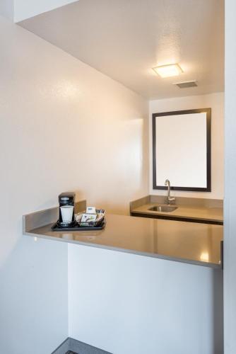 a bathroom with a sink and a counter top at Country Inn & Suites by Radisson, Cookeville, TN in Cookeville