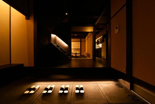 a dark room with a row of lights on the floor at Kuraya Kamigojocho in Kyoto