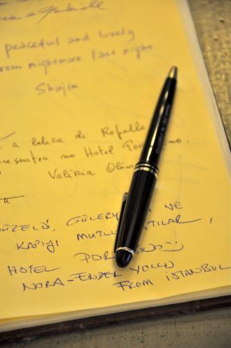a pen sitting on top of a handwritten letter at Hotel Portofino in Rapallo