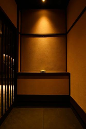 a room with a window with a light on it at Kuraya Kamigojocho in Kyoto