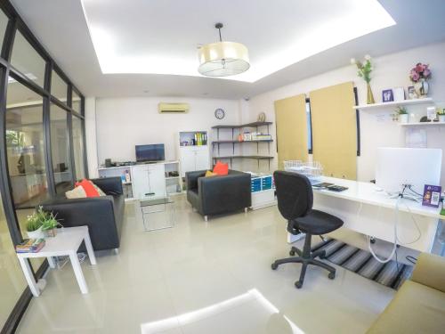 an office with a desk and chairs at Hiran Residence in Patong Beach