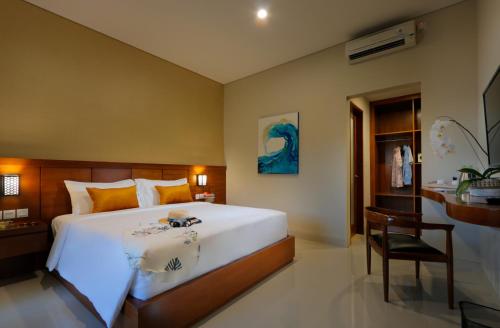 Posteľ alebo postele v izbe v ubytovaní Singgah Hotel Seminyak