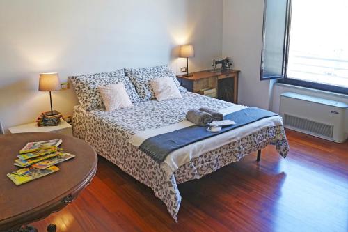 a bedroom with a bed and a wooden floor at BigFamilyFlats - Vatican & Navona in Rome