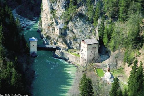 an aerial view of a bridge over a river at Bauernhof Gfraser in Serfaus