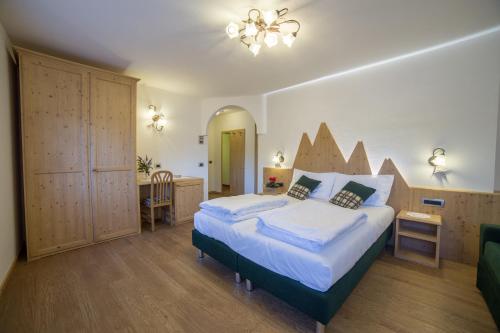 Posteľ alebo postele v izbe v ubytovaní Hotel Bertoldi