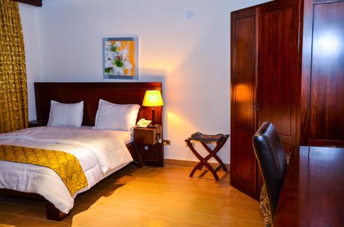 Postel nebo postele na pokoji v ubytování The Cape Hotel