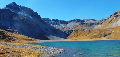 a mountain lake in the middle of a mountain range at B&B Villa Stelvio in Sta Maria Val Müstair