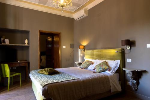 Postel nebo postele na pokoji v ubytování La Rocca Guest House & Spa