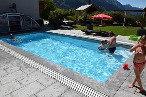 a group of people in a swimming pool at Eisbauer in Sankt Johann im Pongau