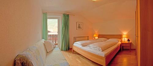 Postel nebo postele na pokoji v ubytování Haus Schlossblick