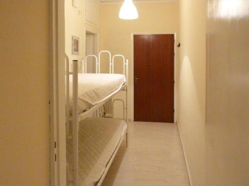 a room with two bunk beds and a door at Homely Spacious Studio in Chalkida