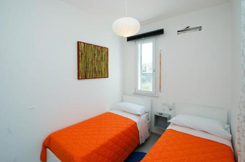 A bed or beds in a room at Villa Barbara...a 100 passi dal mare!!!!