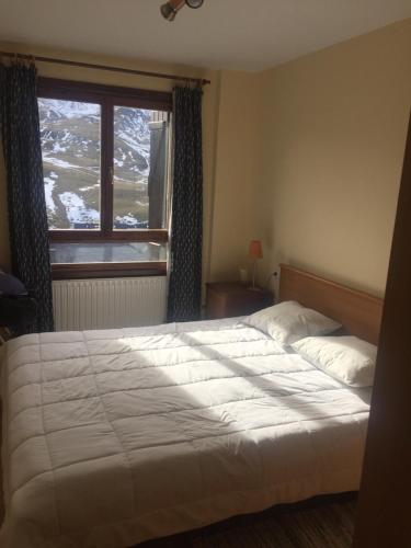 Tempat tidur dalam kamar di Ski & relax Apartment