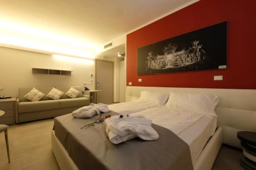 Giường trong phòng chung tại Relais Villa Clodia