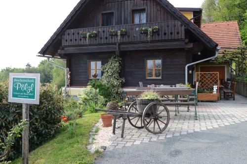 a house with a picnic table in front of it at Weingut & Buschenschank Pölzl in Großklein