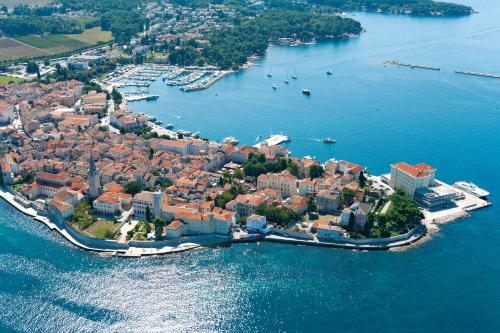 an aerial view of a small island in the water at Hotel Park Plava Laguna in Poreč