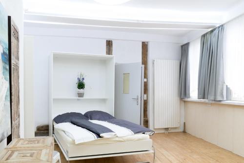 Tempat tidur dalam kamar di Ferienwohnung Wolfenbüttel