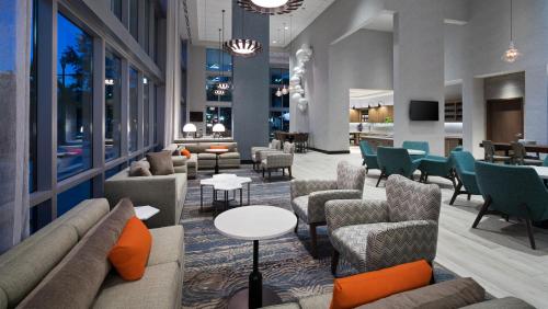 a lobby of a hotel with couches and chairs at Hyatt Place St. Petersburg/Downtown in St Petersburg