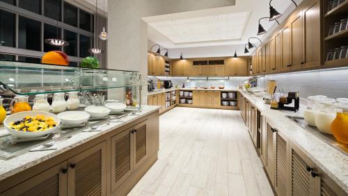 a large kitchen with lots of food on the counters at Hyatt Place St. Petersburg/Downtown in St Petersburg